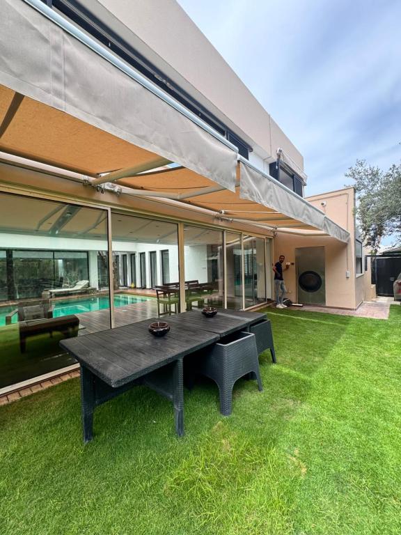Luxury villa with a heated indoor pool and direct access to the beach